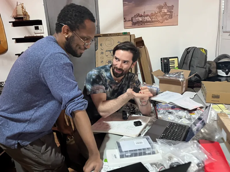 Squawk Works team members collaborating in the workshop