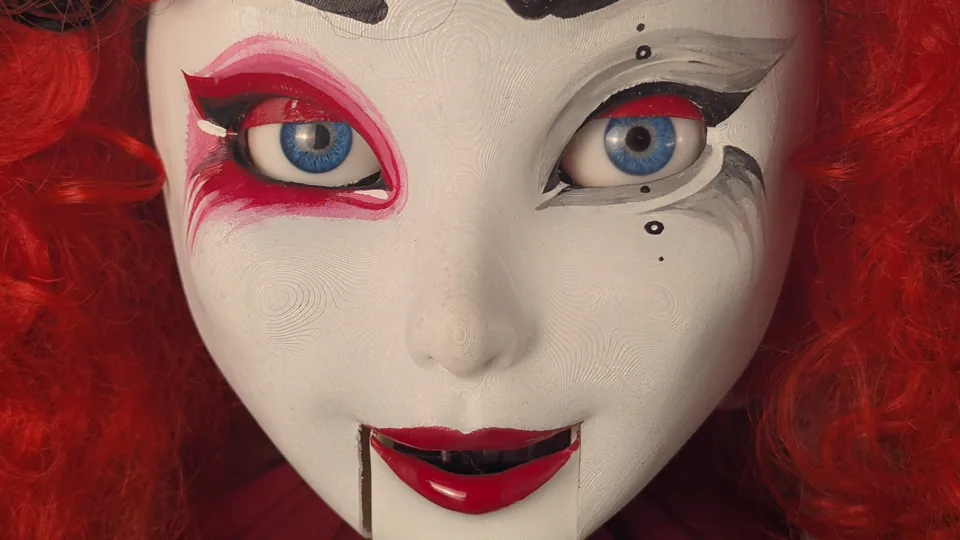 Close-up of a custom red-haired animatronic host character